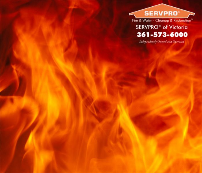 Fire, orange flames covering the entire image.  SERVPRO of Victoria logo and information on the far right hand corner. 