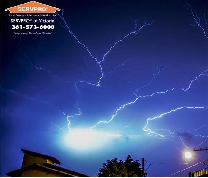 Night time skies with major lightning storm.  SERVPRO of Victoria logo and company information in the top left hand corner. 
