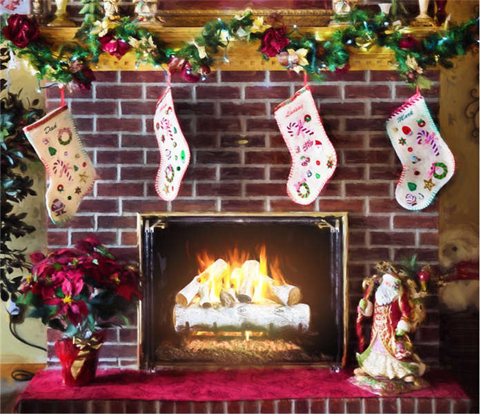 Stockings hung up near a lit fireplace for Christmas